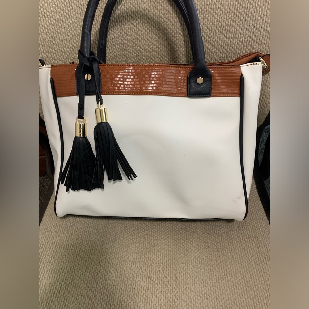 Women's JustFab white, black and brown purse.